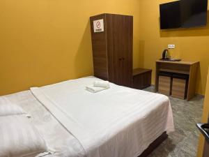 Ένα ή περισσότερα κρεβάτια σε δωμάτιο στο Siren Hotel