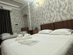 Ένα ή περισσότερα κρεβάτια σε δωμάτιο στο Siren Hotel