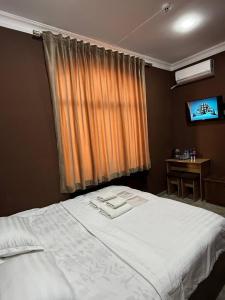 Ένα ή περισσότερα κρεβάτια σε δωμάτιο στο Siren Hotel