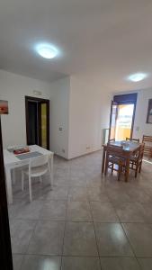 a living room with a white table and chairs at Bed and Bike in Vasto +109 photos