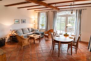 a living room with a couch and a table at Ferienwohnung "Wildgans" in Schaprode