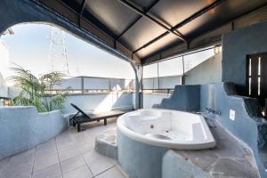 a bathroom with a bath tub in a building at Hotel Mist -Adult Only-CHIBA in Chiba
