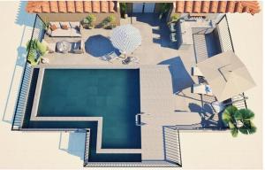 a plan of a house with a swimming pool at The Astor - All Suites Hotel Candolim Goa in Candolim