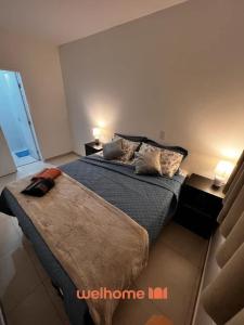 Ένα ή περισσότερα κρεβάτια σε δωμάτιο στο Apartamento em Botucatu com Vista para Montanha