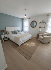 a large bedroom with a large bed and a couch at 3 bedroom home in Sunderland in Pallion