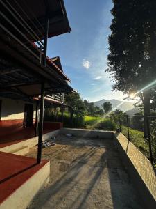 a house under construction with a view of a field at Stay with Nature in Kusma