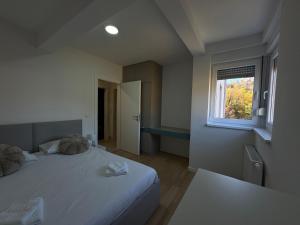 Postel nebo postele na pokoji v ubytování A&A Sarajevo