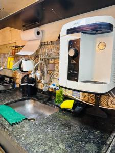 Kuchyň nebo kuchyňský kout v ubytování Fique no coração de Belém