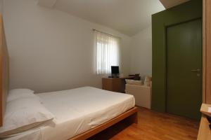 Postel nebo postele na pokoji v ubytování Acquarello