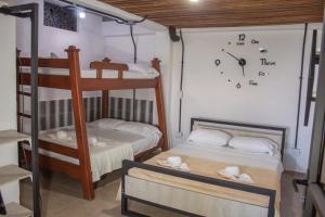 Ένα ή περισσότερα κρεβάτια σε δωμάτιο στο Hotel Curazao Natural Living +12 φωτογραφίες