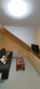 TV a/nebo společenská místnost v ubytování Casa Rural Busto