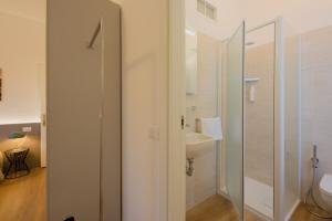 a bathroom with a toilet and a sink at Camera Helsinki - La Casa di Carta Affittacamere in Udine