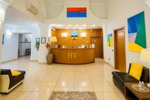 a lobby with a reception desk in a building at Hotiday La Spezia Centrale in La Spezia