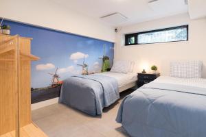 Ένα ή περισσότερα κρεβάτια σε δωμάτιο στο Pakhuis Achter - Rustig gelegen vlakbij Amsterdam & Zaanse Schans