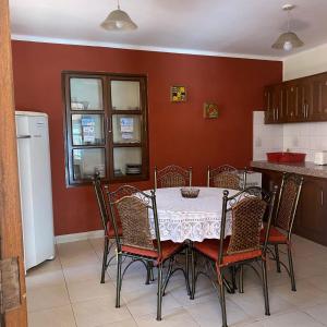 a dining room with a table and chairs in a kitchen at B&B SANTA CECILIA in Sucre