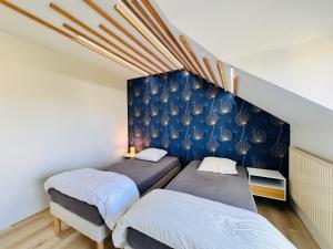 Ένα ή περισσότερα κρεβάτια σε δωμάτιο στο Le Relais des Pilotes - Proche circuit - 12 pers