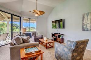 a living room with a couch and chairs and a table at Grand Champions 124 · GC 124 3BD Wailea Condo wAC Pool Hot Tub in Wailea