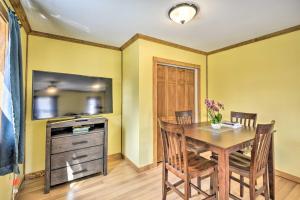 a dining room with a table and a tv at Relaxing Rejuvenation Autumn Midweek - 35 Off Promo! in Pleasant Mount +13 photos