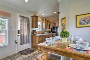a kitchen with a table with dishes on it at Tranquil Trails Cabin & Suites At Equestrian House in Pleasant Mount