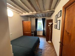 Ένα ή περισσότερα κρεβάτια σε δωμάτιο στο Tavoleria Pisa City Center +4 φωτογραφίες