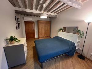 Ένα ή περισσότερα κρεβάτια σε δωμάτιο στο Tavoleria Pisa City Center