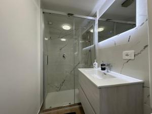a bathroom with a shower and a sink and a mirror at Residenza Aurea Tivoli in Tivoli +20 photos