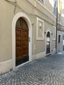 a large wooden door on the side of a building at Residenza Aurea Tivoli in Tivoli