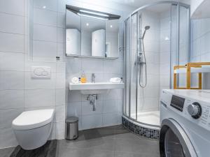 a bathroom with a toilet sink and a shower at Superior Studio at St Stephen's Cathedral City Center - 1 min walk to Vienna City Center in Vienna