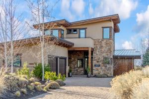 a home with a stone and wood exterior at Arden House in Redmond