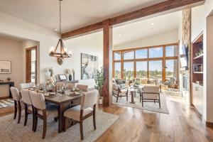 a dining room and living room with a table and chairs at Arden House in Redmond