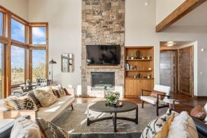 a living room with a couch and a fireplace at Arden House in Redmond