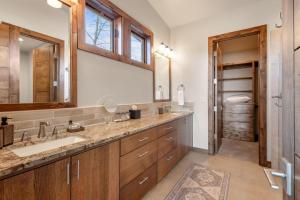 a bathroom with a sink and a large mirror at Arden House in Redmond +38 photos