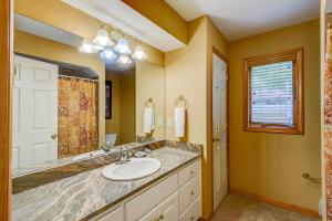 a bathroom with a sink and a mirror at Chetola: Berkshires 3 in Blowing Rock +66 photos