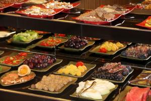 a display case filled with different types of food at Nun Hotel in Konya