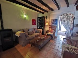 a living room with a couch and a table at Casa ricapaz - Long Term Advantage in Castillo de Locubín