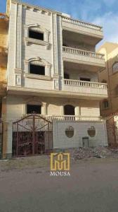 a large white building with a gate in front of it at Party 