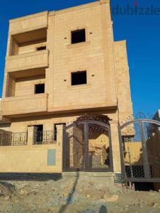 a tall building with a gate in front of it at Party 