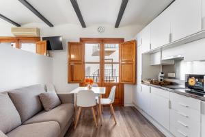 a living room with a couch and a table at Viviaro Peixcateria in Sagunto +17 photos