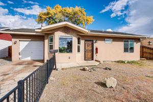 a house with a fence in front of it at Hike and Golf Farmington Home 1 Mi to Animas River! in Farmington