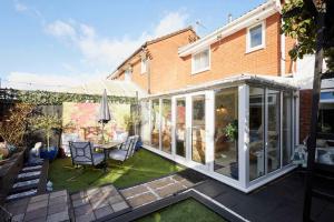 an extension of a house with a conservatory at Host & Stay - The Cheeky Squirrel in New Brighton