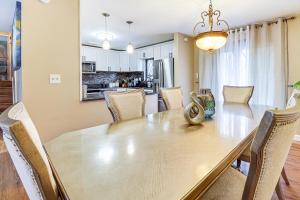a dining room and kitchen with a table and chairs at 3 Mi to South Park Quiet Pittsburgh Area Getaway in Option