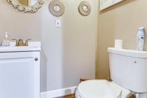 a bathroom with a white toilet and a sink at 3 Mi to South Park Quiet Pittsburgh Area Getaway in Option +16 photos