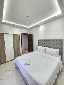 Postel nebo postele na pokoji v ubytování Staylich City View Tanger