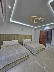 Postel nebo postele na pokoji v ubytování Staylich City View Tanger