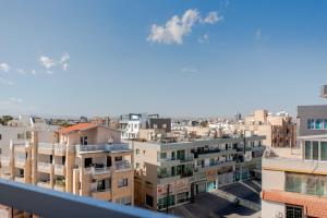 a view of a city from a balcony at TelMar Sky View in Larnaca
