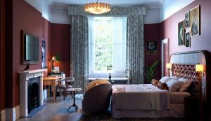 Ένα ή περισσότερα κρεβάτια σε δωμάτιο στο Bertrand's Townhouse