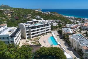 an aerial view of a hotel and the ocean at Oceanfront Infinity Pool Vera Neo Beach Club Gym in San José del Cabo