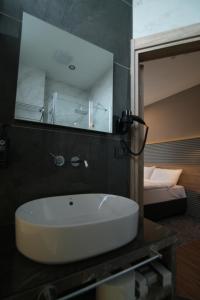 a bathroom with a sink and a mirror at Kent Room Hotel in Kapaklı +24 photos