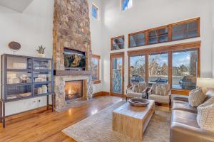 a living room with a couch and a fireplace at Upscale 4 BR Townhouse @ Juniper Preserve Resort in Bend