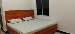 Ένα ή περισσότερα κρεβάτια σε δωμάτιο στο Hotel Mashaal